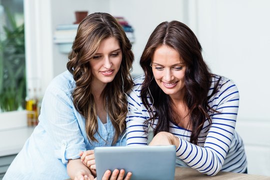 Happy Friends Watching Video On Digital Tablet 