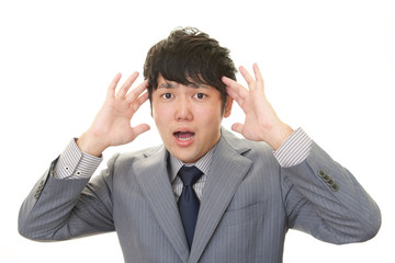 驚いた表情のビジネスマン