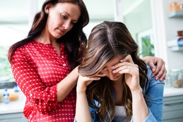 Tensed young woman with friend