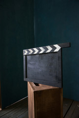 vintage photo of movie clapper on wood