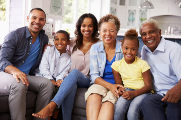 Group portrait of multi generation black family at home - Powered by Adobe