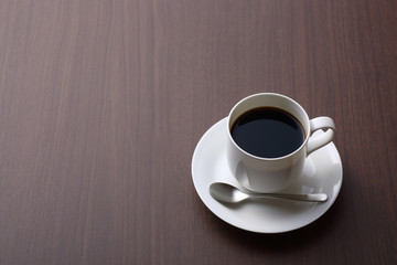 hot coffee on wooden table