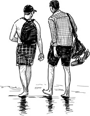 persons walking at seashore