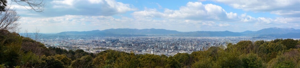 Fototapeta na wymiar Super wide panorama of Kyoto city in Japan and the surrounding landscape and mountains