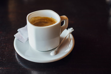 Cup of espresso coffee on the table