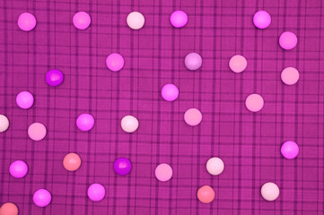 Colorful compostion made of rounds on checkered background.