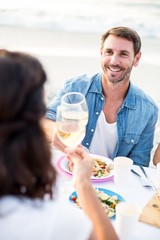 Smiling couple toasting