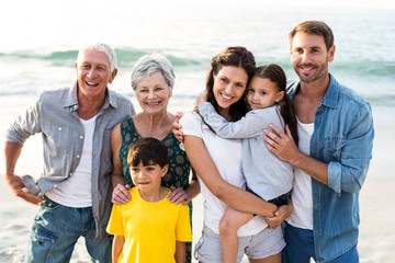 Happy family posing at the beach