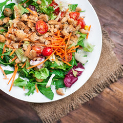 Healthy Salad with arugula, tomatoes and Croutons. Vegetable sal