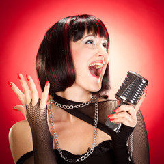 vintage female singer with microphone portrait on red background