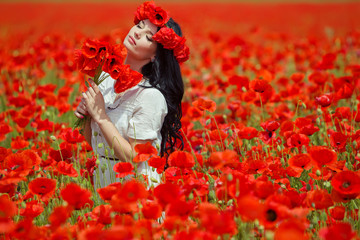 woman in red flowers field 