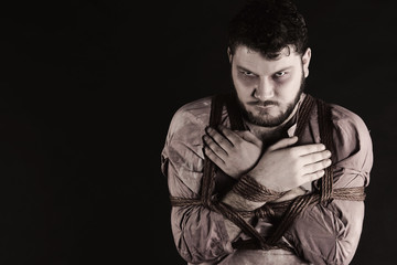 Bound man in slave clothes. Few colors.