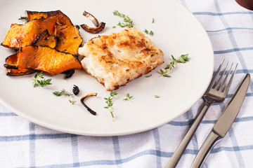 hake fillet and vegetables