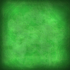 Green grunge background with pale pattern.