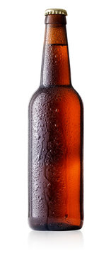Brown cold beer bottle with drops