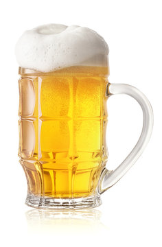 Light beer glass with thick white foam