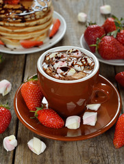 Hot chocolate with marshmallows and strawberries