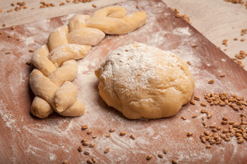 Fototapeta na wymiar Dough braid on flour