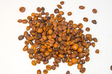 roasted coffee grains on white background