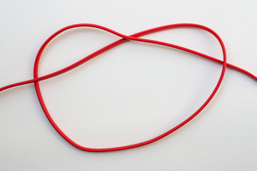Heart-shaped tie of electric wire