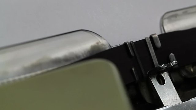 Beginning a new Confidential Document - shallow depth of field and under an angle on a typewriter