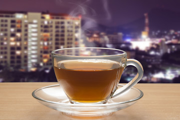 Hot lemon tea on table with out door background