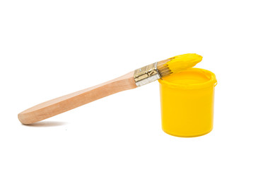 Brush with yellow paint isolated