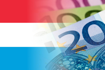 luxembourg flag with euro banknotes