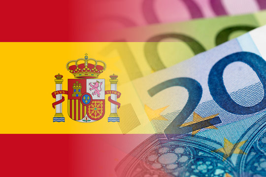 spain flag with euro banknotes