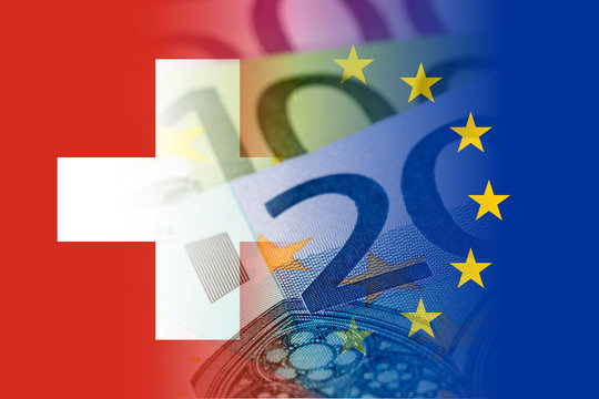 switzerland and eu flags with euro banknotes