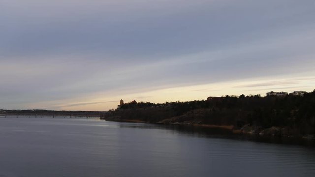 Panorama of bridge from Island to Stockholm filmed during sunrise from a cruise ferry approaching to Sweden