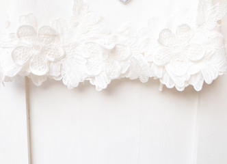 Obraz na płótnie Canvas white lace on white door background 