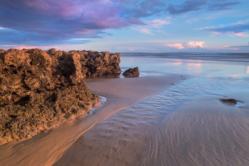 Current water at low tide rock reefs. 