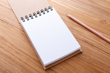 Spiral notebook with pencil