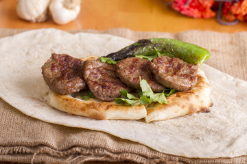Delicious Turkish Traditional Kebab Kofte with pilaf on white plate (meatballs)