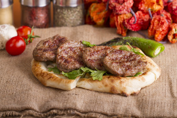 Delicious Turkish Traditional Kebab Kofte with pilaf on white plate (meatballs)