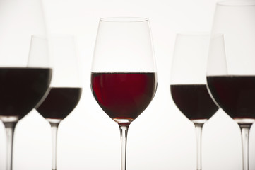 Graphic Composition Glass of red wine on white background
