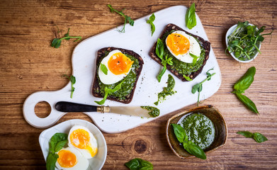 Boiled egg with pesto on toast