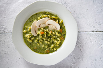 Spinach soup with noodles. - obrazy, fototapety, plakaty