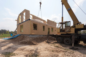 Fototapeta na wymiar New construction of a house/Framed New Construction of a House/Building a new house from the ground up