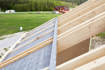 Construction the roof of a new house. Waterproof layering