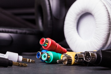 Headphones on black background. Selective focus. Color toned.