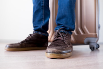 Standing with big baggage