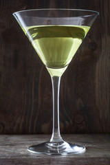 Green apple cocktail on wood background
