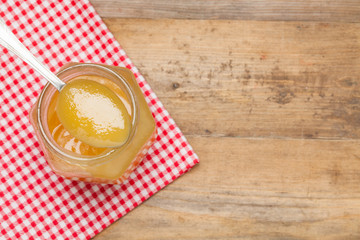 Honey on the wooden background.