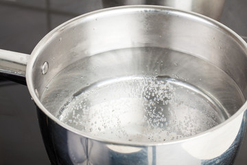 dipper of water on the kitchen stove