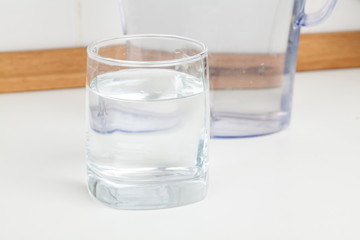 glass of water on a kitchen table
