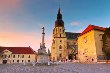 Naklejka na ściany i meble Monument and a church of saint Nicolaus in centre of Trnava, Slovakia.