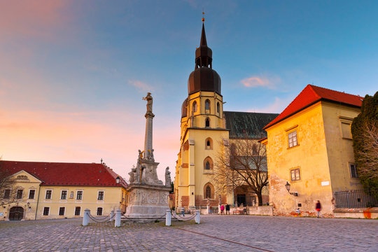 Monument and a church of saint Nicolaus in centre of Trnava, Slovakia.