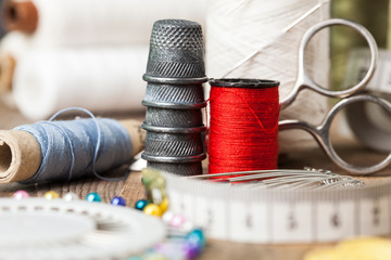 tailor's tool on wooden table.